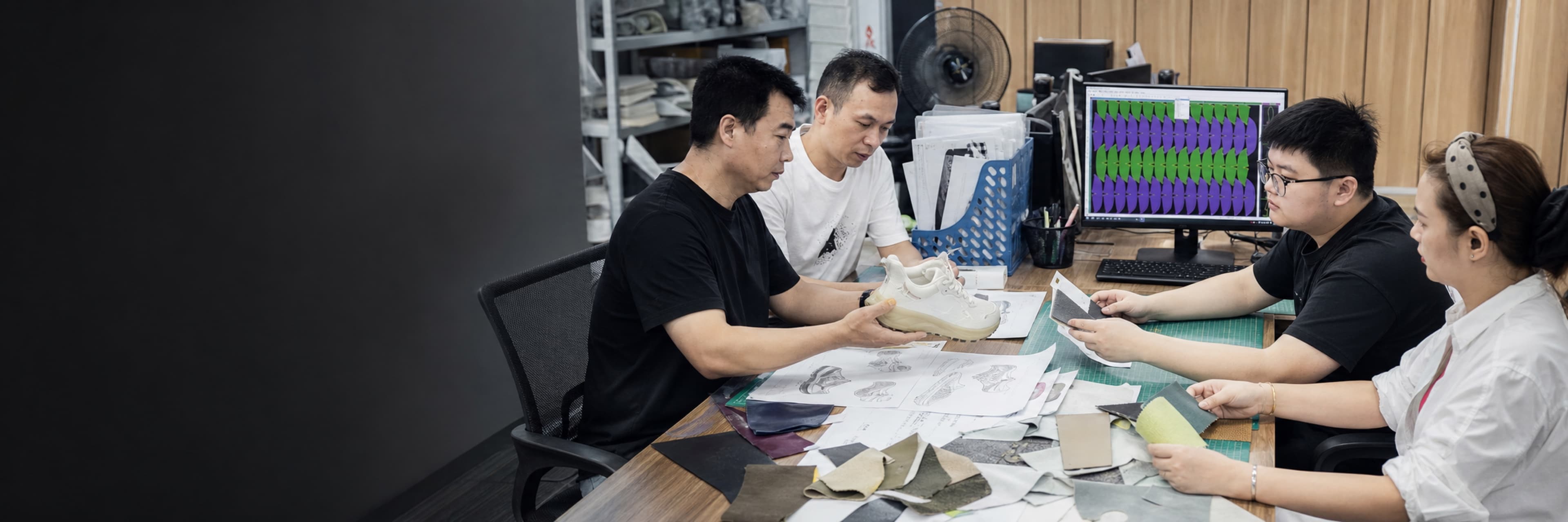 Footwear development team working with samples and project materials